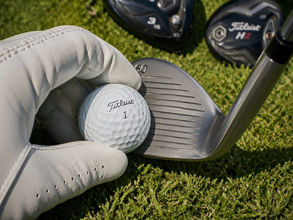 Close-up of tour-level golf ball and wedge for breaking 70 scoring shots